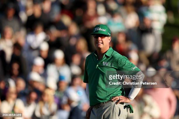 Charley Hoffman of the United States looks on from the 18th green during the final round of the WM Phoenix Open at TPC Scottsdale on February 11,...