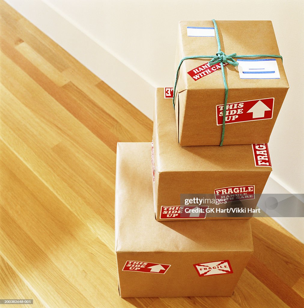 Stack of boxes labelled 'Fragile - Handle With Care', elevated view