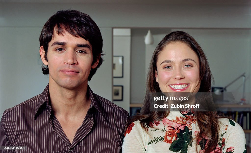 Young couple, smiling, portrait