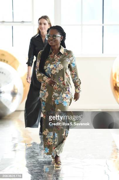 Designer Aderiyike Makinde walks the runway for BELIEVE by tuula rossi with Meghan Jean Jewelry, bags by Suave Suede, and Aderiyike London...