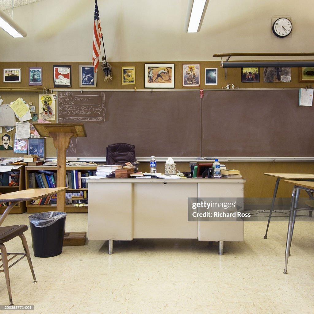 Classroom with teacher's desk in middle of room