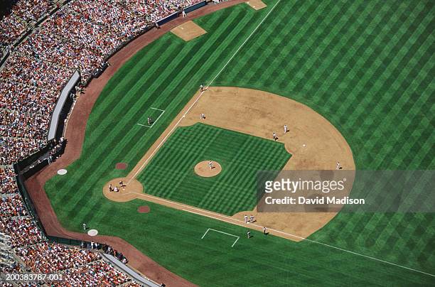 baseball stadium during game, aerial view - baseball stock pictures, royalty-free photos & images