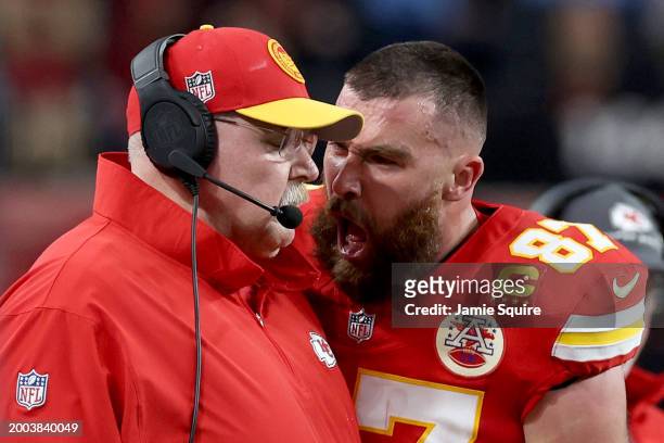 Travis Kelce of the Kansas City Chiefs reacts at Head coach Andy Reid in the first half against the San Francisco 49ers during Super Bowl LVIII at...