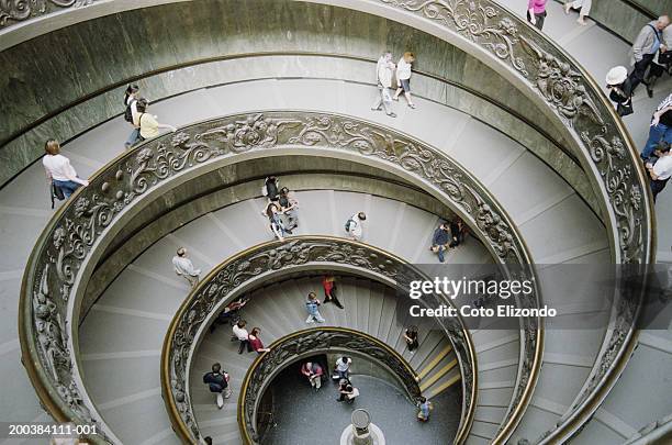 italy, rome, vatican museum, tourists on staircase, elevated view - italien rom stock-fotos und bilder