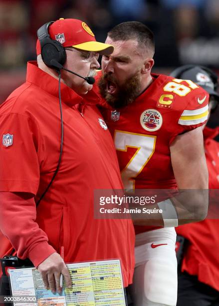 Travis Kelce of the Kansas City Chiefs reacts at Head coach Andy Reid in the first half against the San Francisco 49ers during Super Bowl LVIII at...