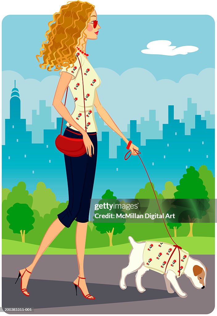 Woman walking dog in park, cityscape in background, side view