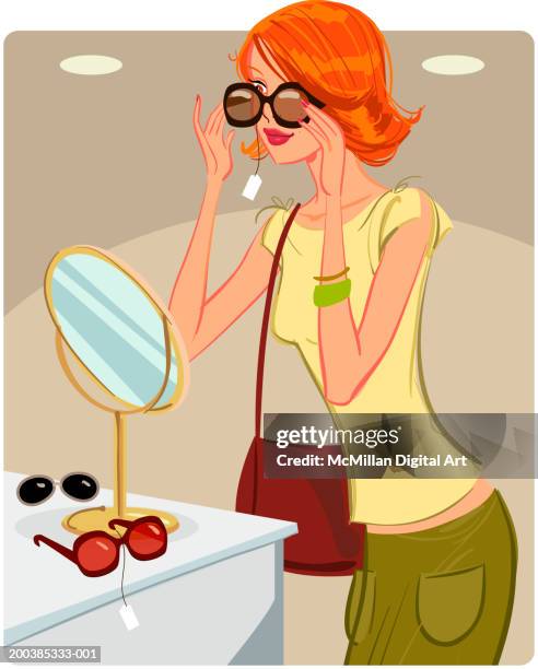 woman trying on sunglasses in retail store - sunglasses woman stock illustrations