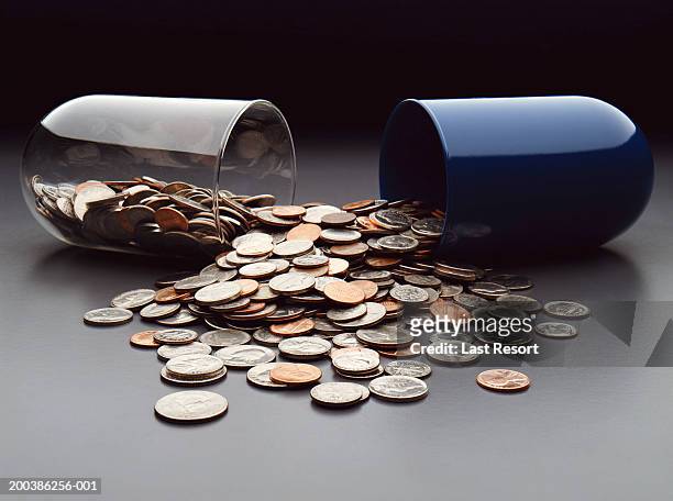 usa coins spilling out of broken capsule - tiocentsmynt bildbanksfoton och bilder