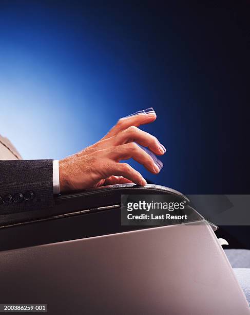 man tapping chair arm, close-up (blurred motion) - tapping stock pictures, royalty-free photos & images