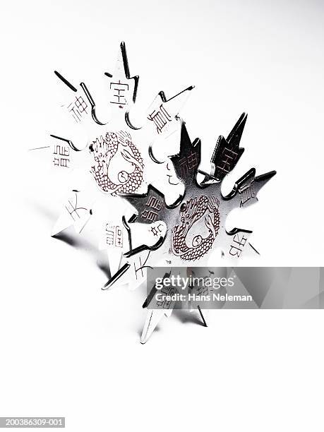 star shape martial arts weapon, overhead view, close-up - throwing star stock pictures, royalty-free photos & images