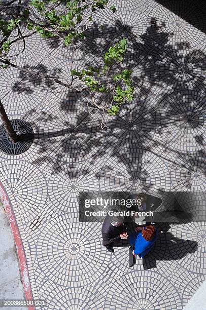 three executives talking on sidewalk, overhead view - cobblestone pattern stock pictures, royalty-free photos & images