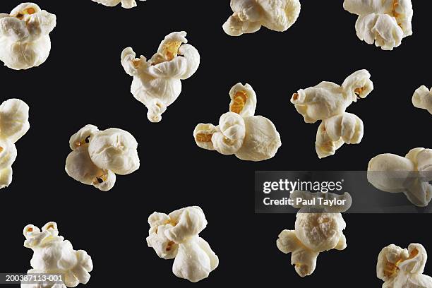 popcorn on black background - popcorn bildbanksfoton och bilder