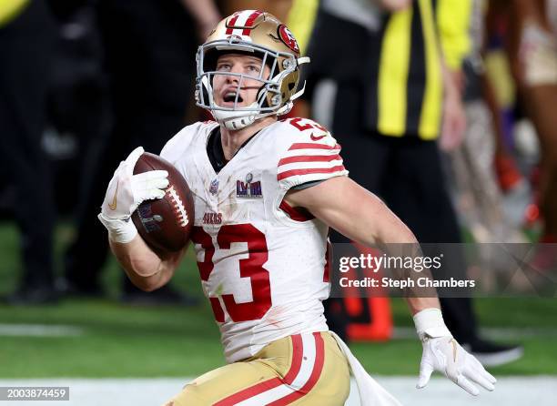 Christian McCaffrey of the San Francisco 49ers runs the ball for a touchdown in the second quarter against the Kansas City Chiefs during Super Bowl...