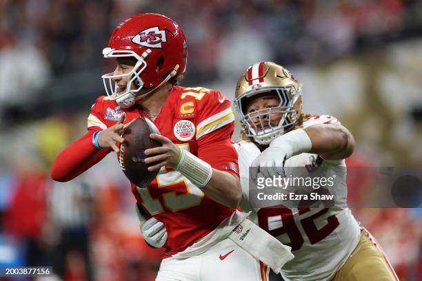 Patrick Mahomes of the Kansas City Chiefs is tackled by Chase Young of the San Francisco 49ers in the second quarter during Super Bowl LVIII at...