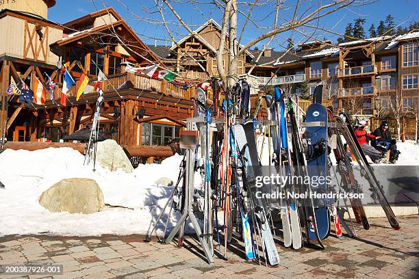 skis and snowboards in rack - whistler village stock pictures, royalty-free photos & images