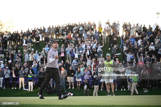Nick Taylor of Canada celebrates making a putt for birdie on the first-playoff hole during the final round of the WM Phoenix Open at TPC Scottsdale...
