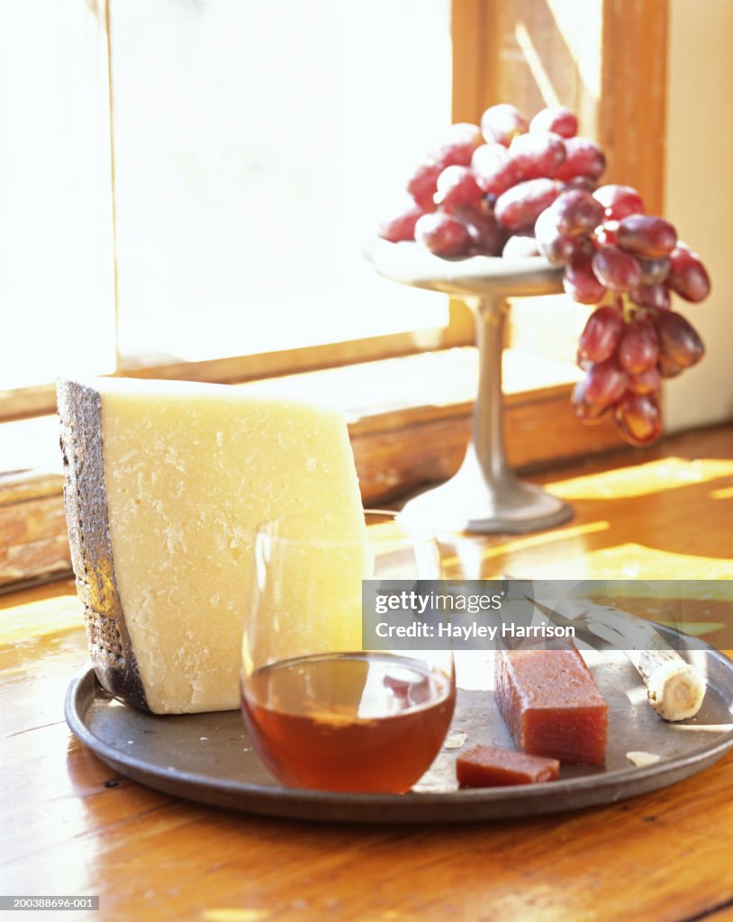 Parmesan cheese served with quince paste and liquer