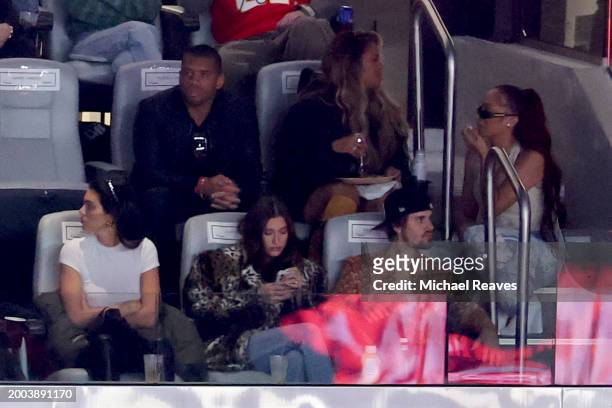 Player Russell Wilson, Hailey Bieber, singer Ciara, singer Justin Bieber, and celebrity Kendall Jenner look on in the first half during Super Bowl...