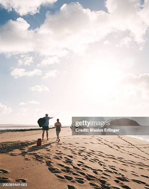 people on beach - footprints on beach australia stock-fotos und bilder