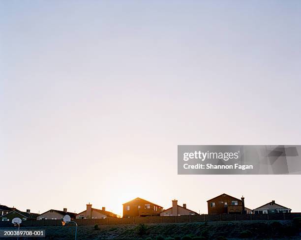 row of suburban houses, sunset - suburb stock pictures, royalty-free photos & images