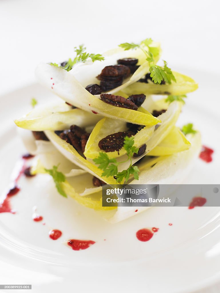 Belgian endive salad with candied and peppered pecans and cranberries