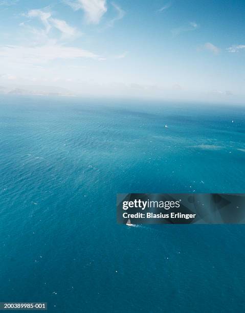 sailboat at sea, aerial view - aerial single object stock pictures, royalty-free photos & images