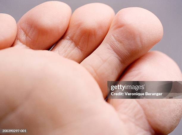 close-up of man's toes - human foot anatomy stock pictures, royalty-free photos & images