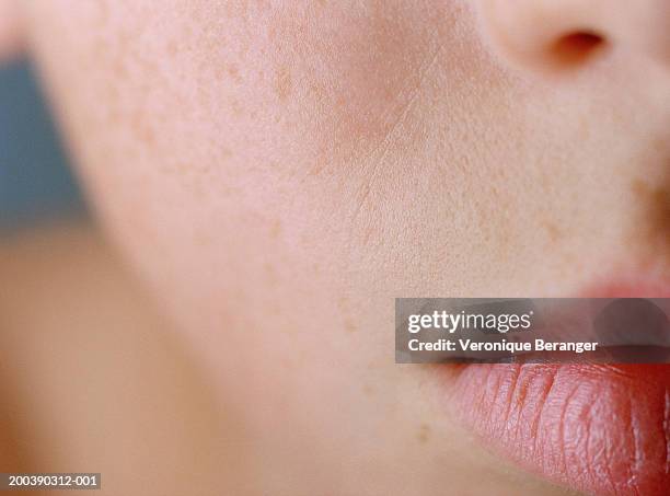 close-up of teenage boy's (13-15) face - epidermis stock-fotos und bilder