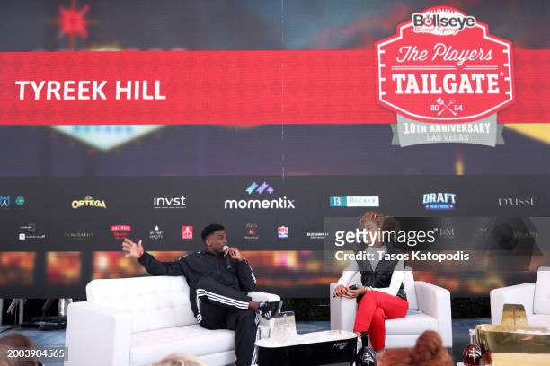 Tyreek Hill and Sage Steele speak onstage during The Players Tailgate hosted by Bobby Flay presented by Bullseye Event Group for Super 58 on February...