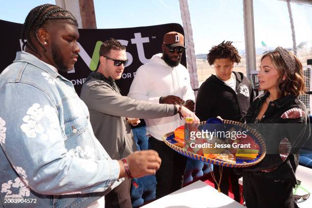 Tyler Booker, Lindsay Crook, Donald Thomas, Jason Booker, and Kelsey Murphy attend The Players Tailgate hosted by Bobby Flay presented by Bullseye...