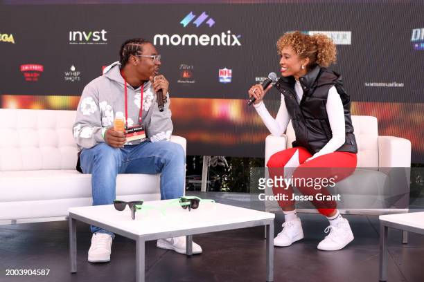 Jamaal Williams and Sage Steele speak onstage during The Players Tailgate hosted by Bobby Flay presented by Bullseye Event Group for Super 58 on...