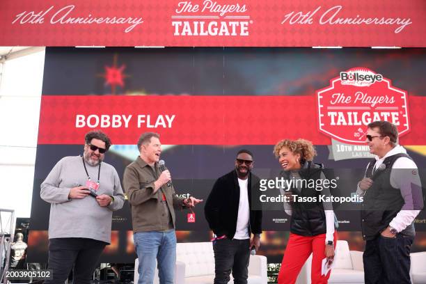 Aaron May, Bobby Flay, DJ Irie, Sage Steele, and Kyle Kinnett speak onstage during The Players Tailgate hosted by Bobby Flay presented by Bullseye...