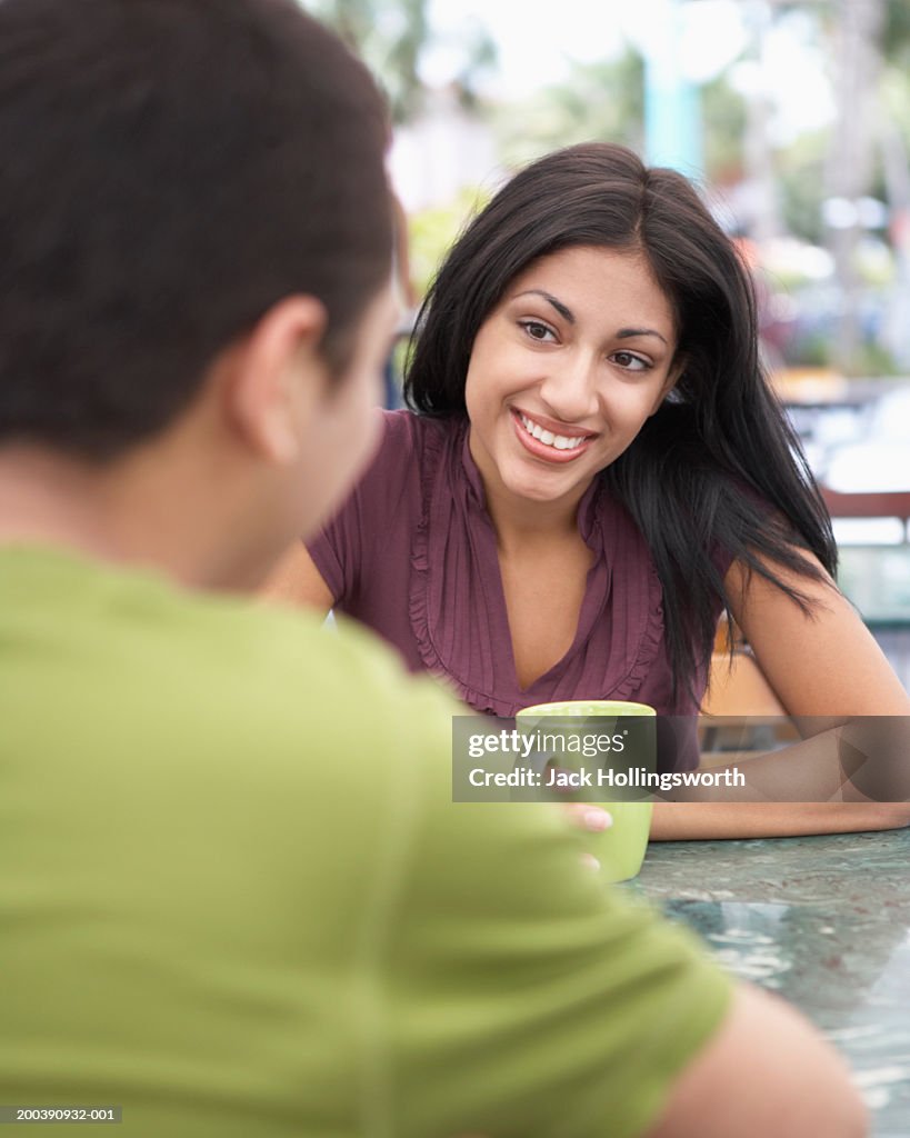 Young couple sitting together at a cafe