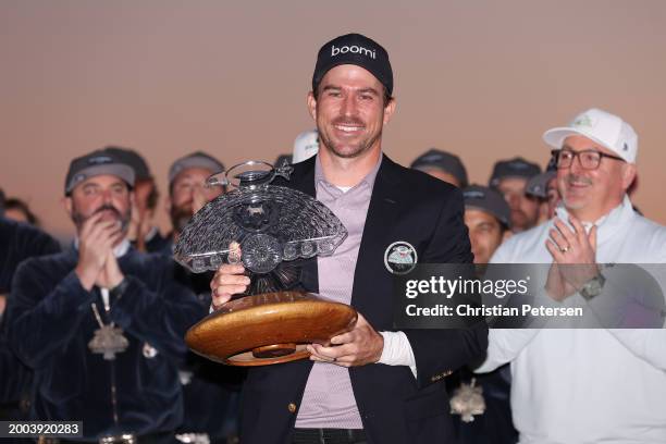 Nick Taylor of Canada celebrates with the trophy after winning in a two-hole playoff during the final round of the WM Phoenix Open at TPC Scottsdale...