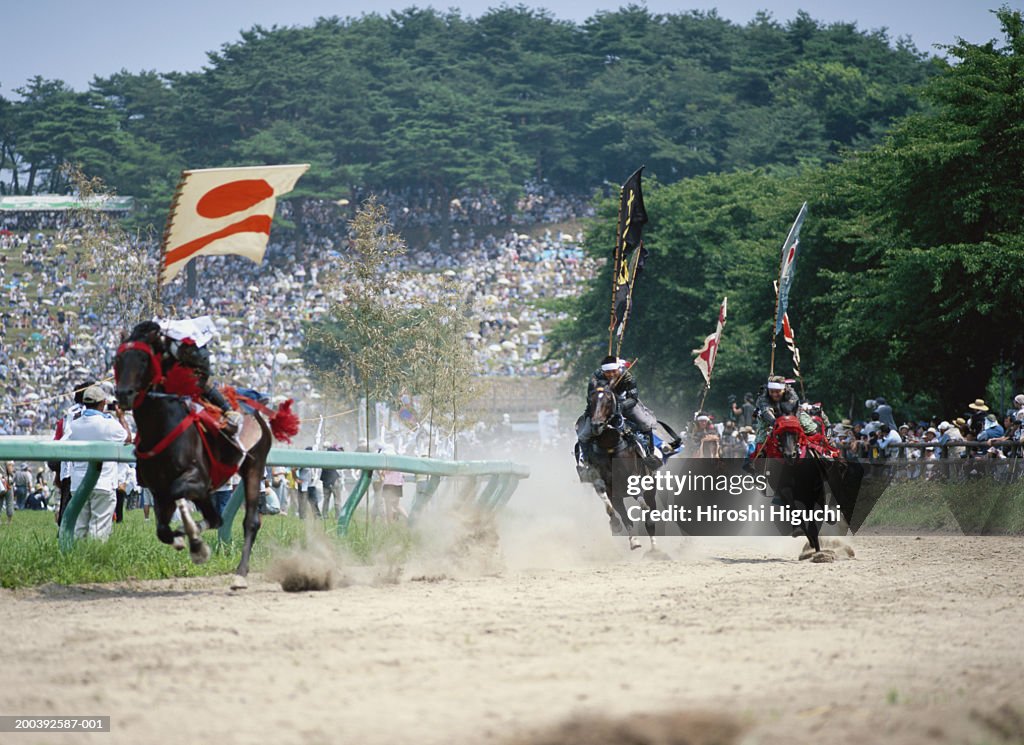 Japan, The Soma Nomaoi Festival, Samurai carrying flags racing horses