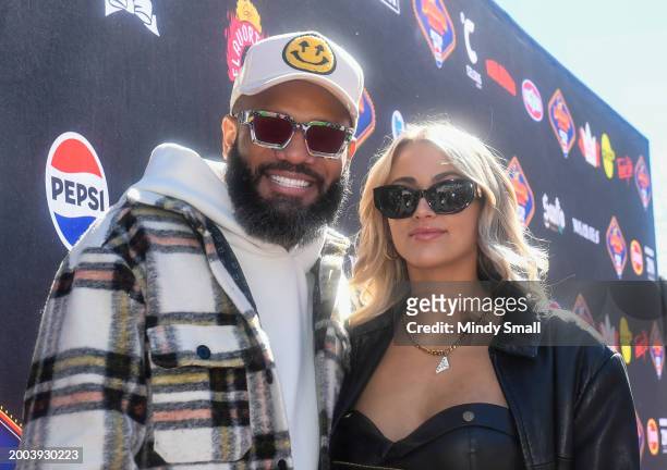Justin Sutherland and Serena Lange arrive at Guy Fieri's Flavortown Tailgate on February 11, 2024 in Las Vegas, Nevada.