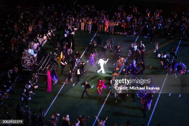 Usher performs on the field during the Apple Music Super Bowl LVIII Halftime Show at Allegiant Stadium on February 11, 2024 in Las Vegas, Nevada.