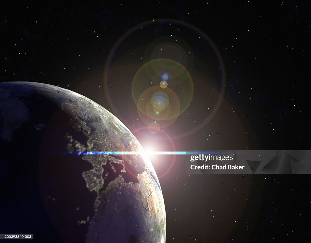 Earth in partial sunlight with city lights
