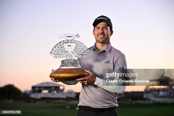 Nick Taylor of Canada celebrates with the trophy after winning in a two-hole playoff during the final round of the WM Phoenix Open at TPC Scottsdale...