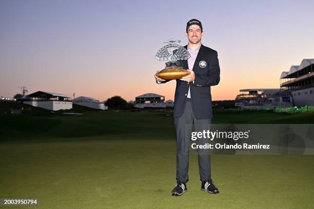 Nick Taylor of Canada celebrates with the trophy after winning in a two-hole playoff during the final round of the WM Phoenix Open at TPC Scottsdale...