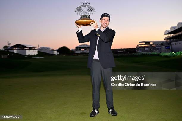 Nick Taylor of Canada celebrates with the trophy after winning in a two-hole playoff during the final round of the WM Phoenix Open at TPC Scottsdale...