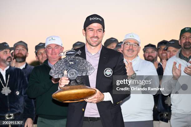 Nick Taylor of Canada celebrates with the trophy after winning in a two-hole playoff during the final round of the WM Phoenix Open at TPC Scottsdale...