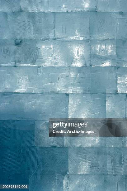 wall composed of bricks of ice, full frame - blue brick stock pictures, royalty-free photos & images