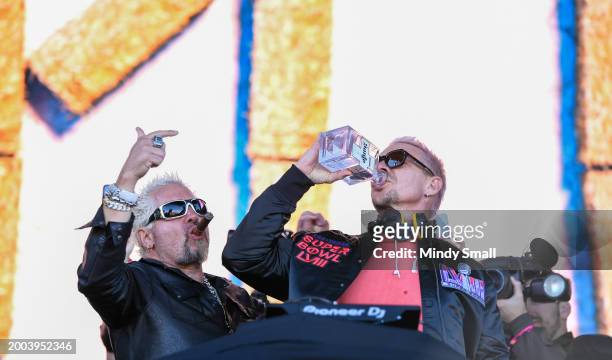 Guy Fieri and Diplo onstage at Guy Fieri's Flavortown Tailgate on February 11, 2024 in Las Vegas, Nevada.