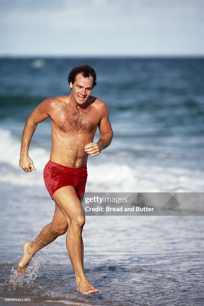 Man running at beach