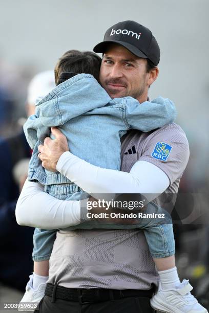 Nick Taylor of Canada celebrates with son Charlie after winning in a two-hole playoff during the final round of the WM Phoenix Open at TPC Scottsdale...