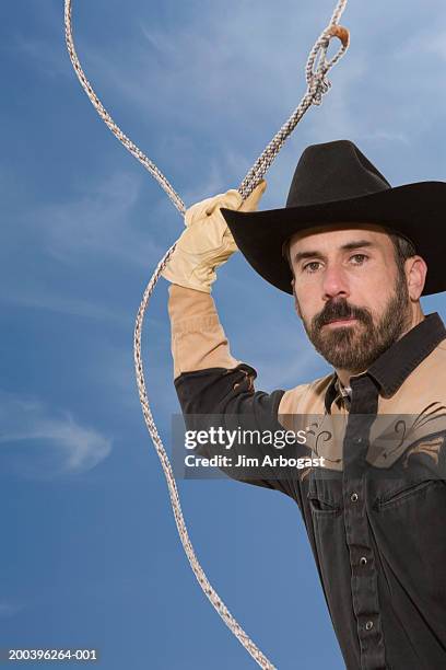 Cowboy Holding Rope Photos and Premium High Res Pictures - Getty Images