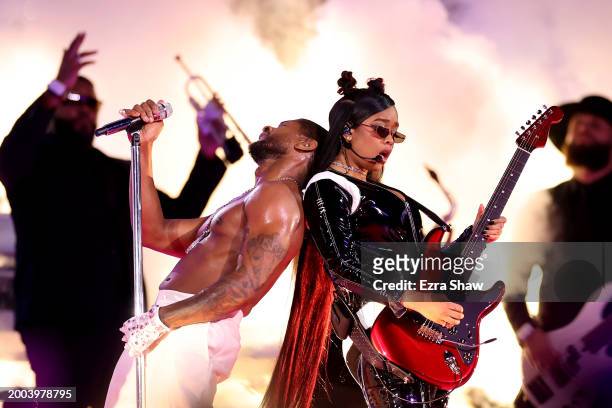 Usher and H.E.R. Perform onstage during the Apple Music Super Bowl LVIII Halftime Show at Allegiant Stadium on February 11, 2024 in Las Vegas, Nevada.