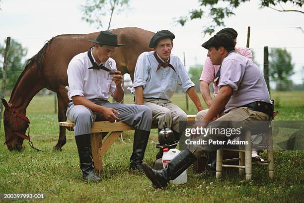 argentina, gauchos drinking yerba mate - san antonio de areco fotografías e imágenes de stock