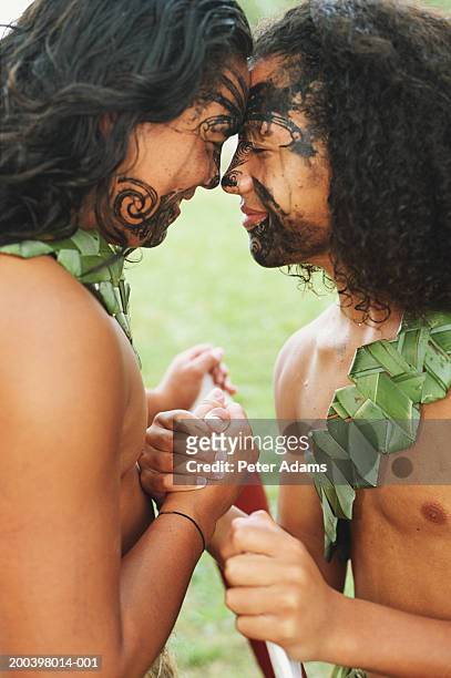 new zealand, north island, maori traditional hongi greeting, side view - maori stock-fotos und bilder